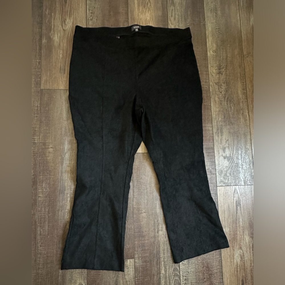 Faux suede pants.  Lots of stretch , pull on style boot cut.  Size 18